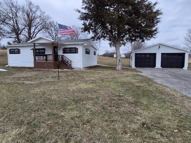 view of yard with a garage and an outdoor structure