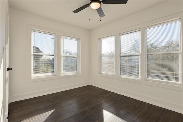 unfurnished sunroom with ceiling fan