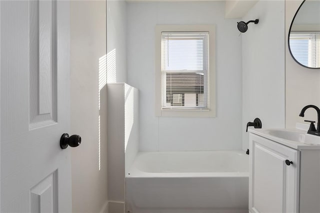 bathroom with a bath and vanity