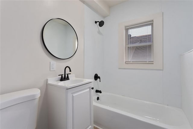 bathroom featuring toilet, washtub / shower combination, and vanity