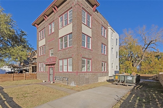 view of property with fence