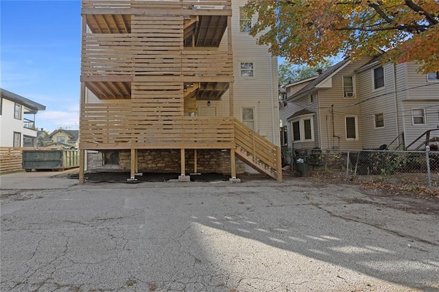 back of house featuring fence