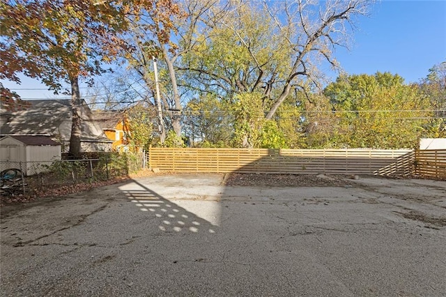 view of gate featuring a fenced front yard