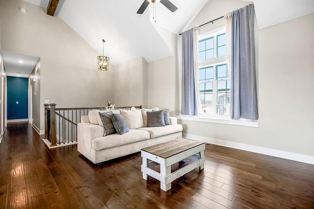 living room with beamed ceiling, high vaulted ceiling, ceiling fan with notable chandelier, hardwood / wood-style flooring, and baseboards