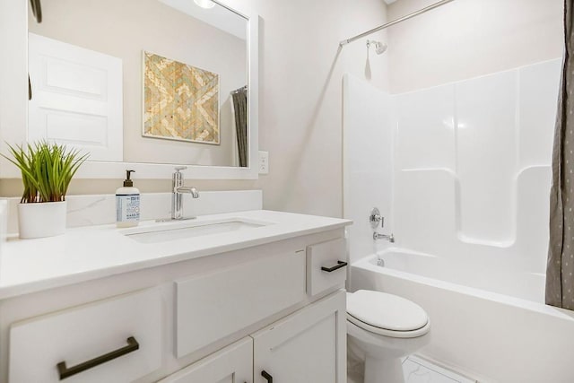 bathroom featuring marble finish floor, shower / bath combination with curtain, toilet, and vanity