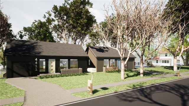 view of front facade with a garage and a front yard