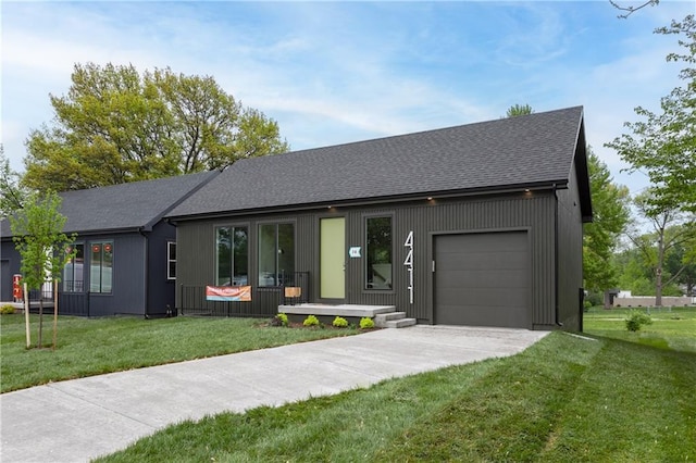 4413 E 135th St, Grandview, MO 64030 - view of front of home with driveway, an attached garage, roof with shingles, a front lawn, and covered porch