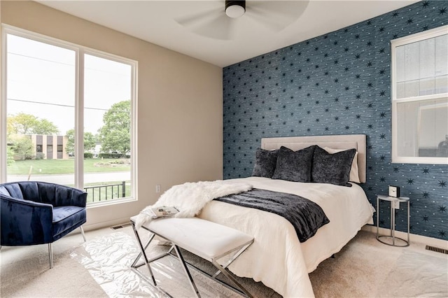 4413 E 135th St, Grandview, MO 64030 - carpeted bedroom featuring wallpapered walls, baseboards, and a ceiling fan