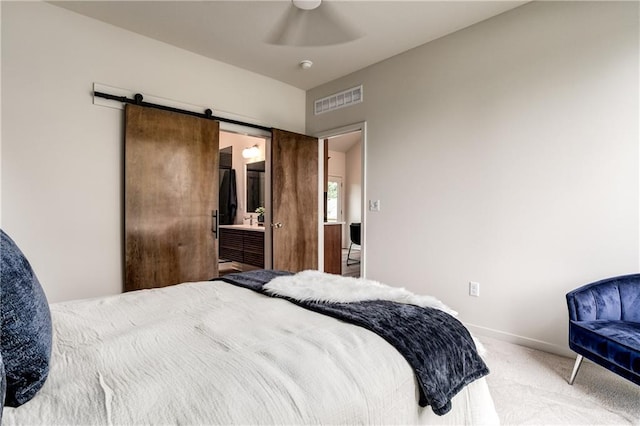 4413 E 135th St, Grandview, MO 64030 - carpeted bedroom featuring a barn door, baseboards, a ceiling fan, and ensuite bathroom