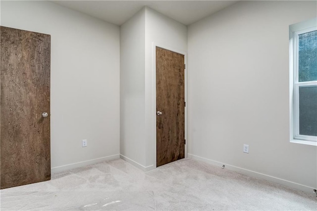 4413 E 135th St, Grandview, MO 64030 - empty room featuring carpet flooring and baseboards
