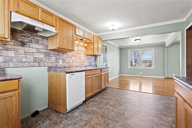 kitchen featuring under cabinet range hood, tasteful backsplash, white dishwasher, and crown molding