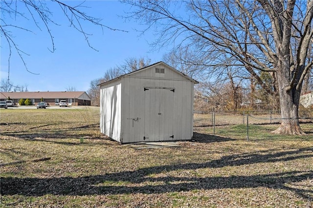 view of shed with fence