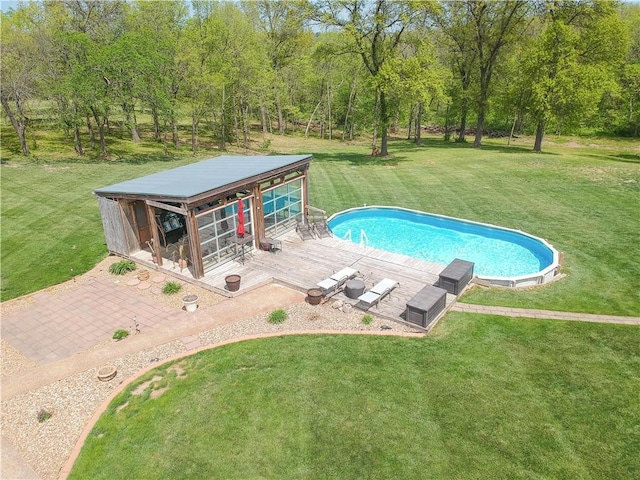 pool featuring an outdoor structure, exterior structure, and a lawn