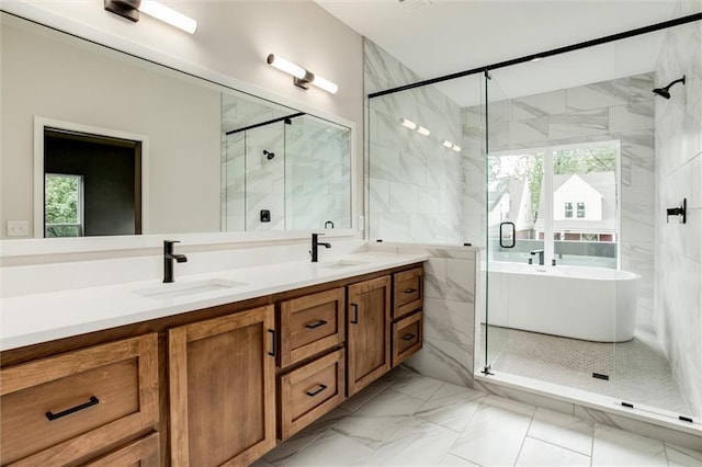 3322 Tracy Ave, Kansas City, MO 64109 - full bathroom featuring marble finish flooring, a stall shower, double vanity, and a freestanding tub