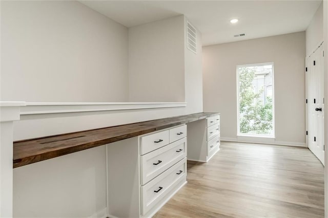 3322 Tracy Ave, Kansas City, MO 64109 - interior space with light wood-style floors, baseboards, and recessed lighting