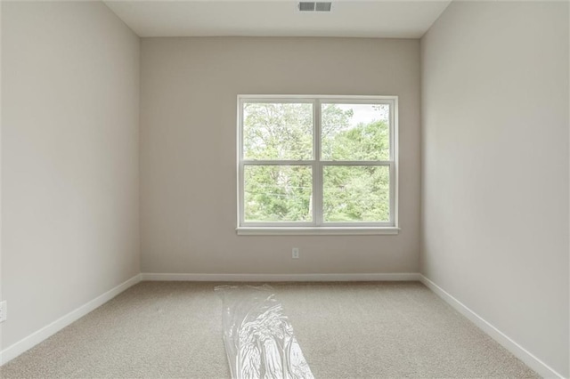 3322 Tracy Ave, Kansas City, MO 64109 - unfurnished room featuring carpet and baseboards