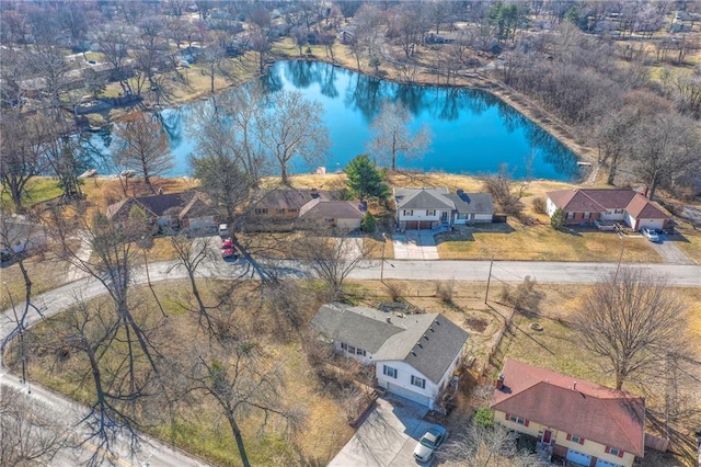 bird's eye view with a residential view and a water view