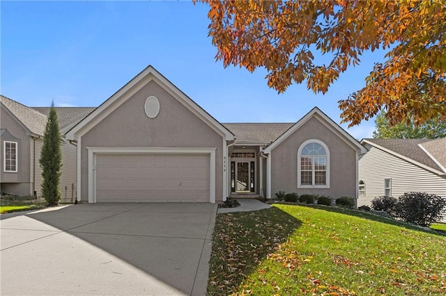 single story home featuring a garage, concrete driveway, a front yard, and stucco siding