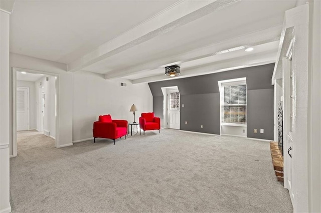 unfurnished room featuring beamed ceiling, visible vents, baseboards, and carpet floors