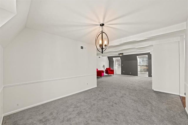 empty room featuring baseboards, visible vents, lofted ceiling, carpet flooring, and a chandelier