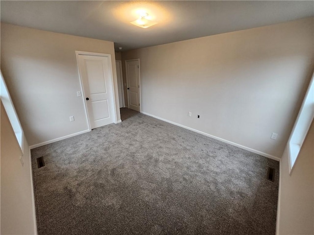 unfurnished bedroom with carpet and baseboards