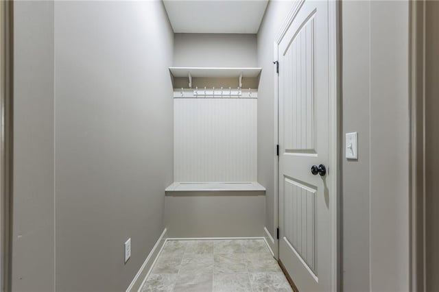 interior space featuring baseboards