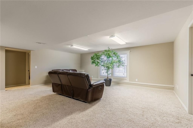 carpeted living room with baseboards