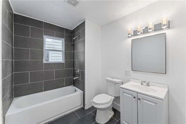 bathroom with visible vents, toilet, shower / bathtub combination, tile patterned flooring, and vanity