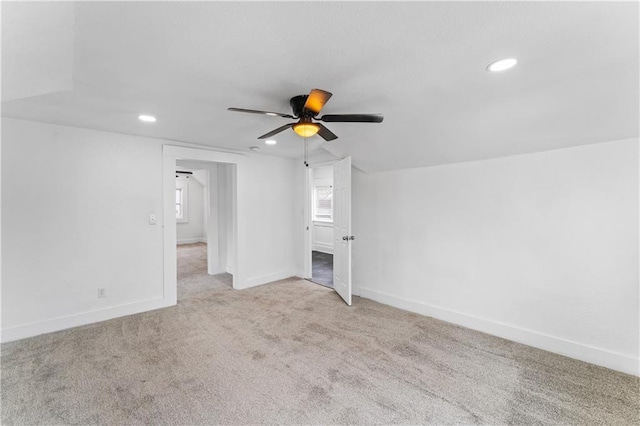 interior space with carpet floors, recessed lighting, baseboards, and a ceiling fan