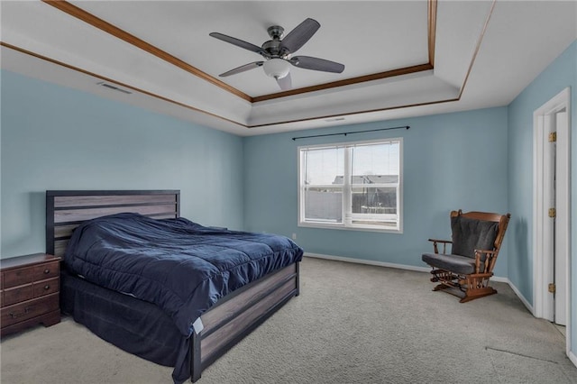 bedroom featuring visible vents, carpet flooring, baseboards, and a tray ceiling