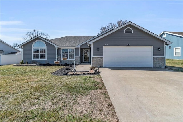 ranch-style house featuring stone siding, driveway, an attached garage, and a front yard