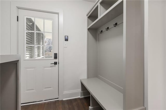 mudroom featuring dark wood-style floors and baseboards