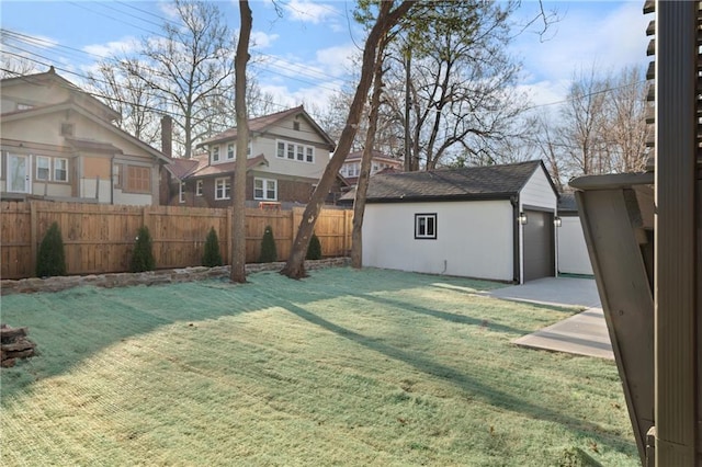 view of yard featuring an outbuilding and a fenced backyard