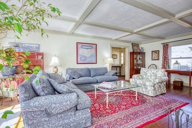 living room with beam ceiling, coffered ceiling, a textured ceiling, and wood finished floors