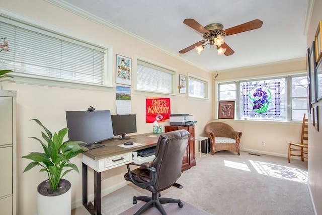 office area featuring crown molding, light colored carpet, baseboards, and ceiling fan