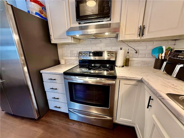 kitchen with white cabinetry, decorative backsplash, wall chimney exhaust hood, and appliances with stainless steel finishes