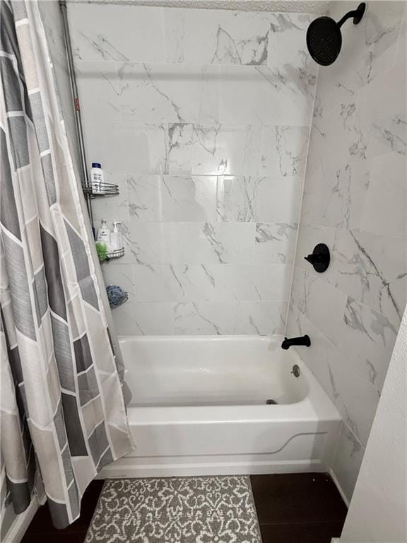 full bathroom with shower / bath combo