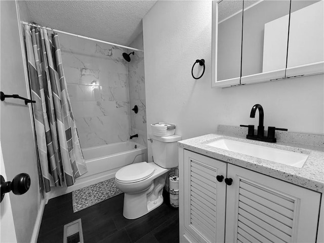 full bath featuring vanity, visible vents, shower / bath combo, a textured ceiling, and toilet