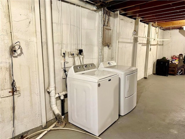 clothes washing area with laundry area and independent washer and dryer