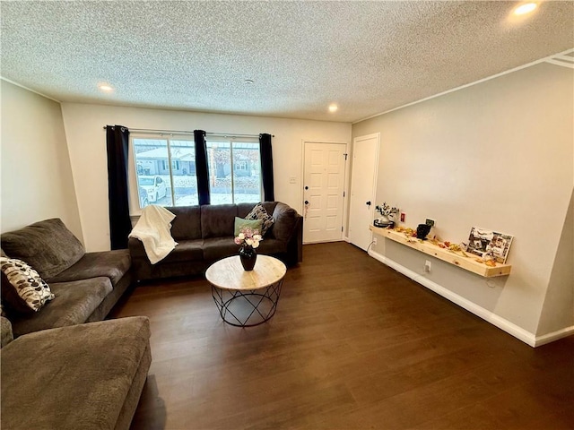 living room featuring baseboards, a textured ceiling, and dark wood-style flooring