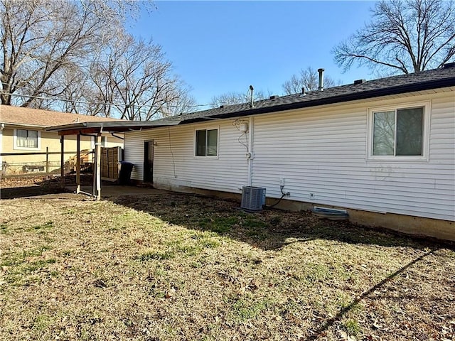 rear view of property with a patio and a yard