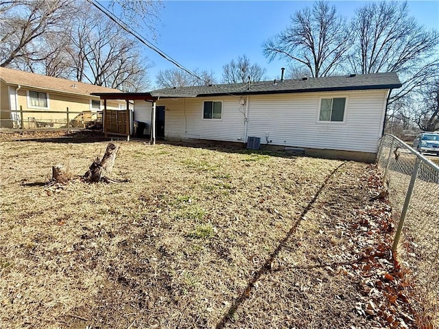 rear view of house with fence