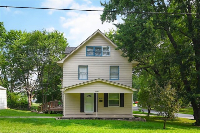 view of front of property featuring a porch and a front yard