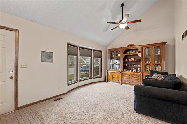 carpeted living room with lofted ceiling, visible vents, a ceiling fan, a textured ceiling, and baseboards