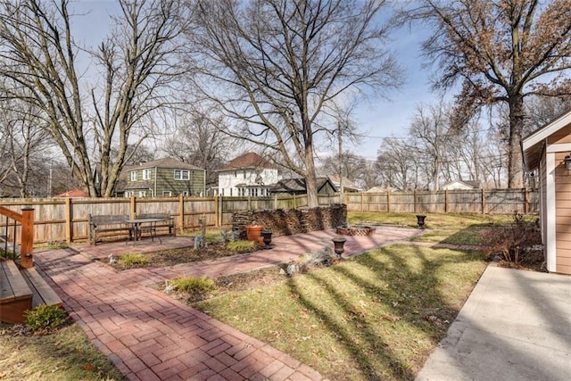 view of yard with a patio and a fenced backyard