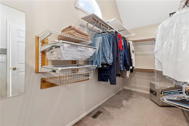 spacious closet featuring visible vents and carpet