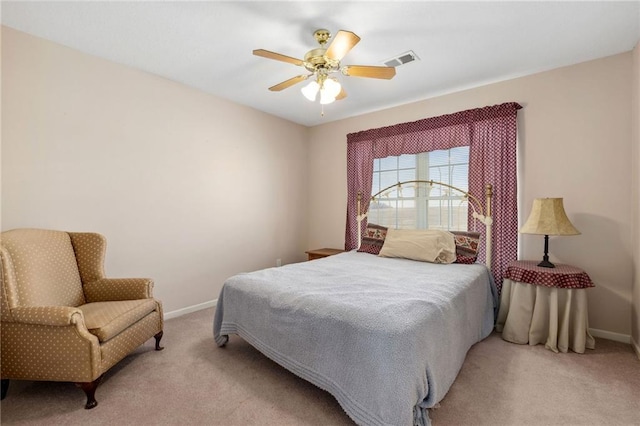 bedroom featuring light carpet, visible vents, and baseboards