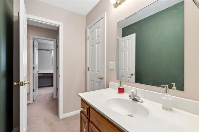 bathroom with baseboards and vanity