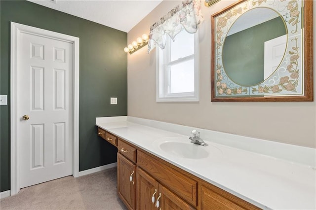 bathroom with vanity and baseboards