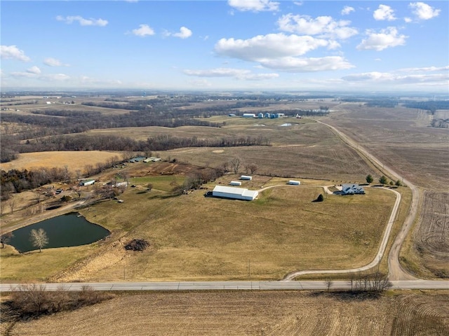 birds eye view of property featuring a rural view and a water view